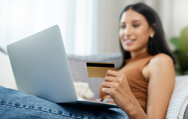 Image showing Laptop, credit card and woman on sofa for online shopping, e commerce and digital payment or order at home. Relax person on computer with internet banking, security numbers or registration for a loan