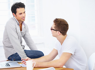 Image showing Creative, business men and discussion at desk in office for planning project, company collaboration and talking to employees. Designers, teamwork and conversation at table together in startup agency