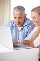 Image showing Married couple, laptop and video call with smile, conversation and living room couch. Social media, technology and communication at home, husband and wife with connection, streaming and happy