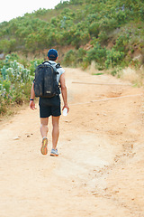 Image showing Fitness, back or man hiking in nature with water, backpack or energy drink for workout, training or exercise freedom. Hiker, Brazil or walking on mountains path for health, wellness or summer sports