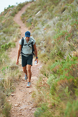 Image showing Fitness, backpack or man hiking in nature with water, bag or energy drink for workout, training or exercise freedom. Hiker, Brazil or walking on mountains path for health, wellness or summer sports