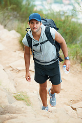 Image showing Portrait, hiking and man with nature, fitness and exercise with wellness, fresh air or challenge. Person, hiker or guy with backpack, hobby or activity with workout, training or endurance with travel