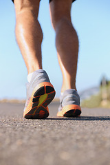 Image showing Man, shoes and legs running on road for fitness, workout or outdoor exercise on asphalt. Closeup of male person or athlete on street with sneakers for run, cardio or floor grip in health and wellness