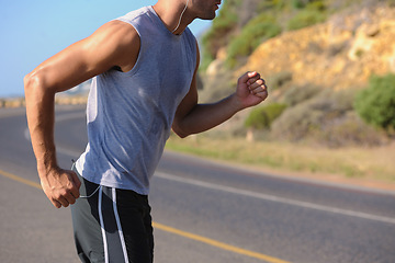 Image showing Fitness, sweat and man athlete in mountain running for race, marathon or competition training. Sports, workout and body of male runner doing a cardio exercise for health or wellness in outdoor nature