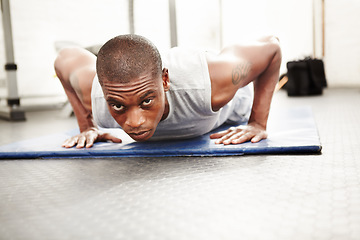 Image showing Black man, gym and push up at a wellness club with exercise, fitness and workout with strength. Power, floor and African male athlete with training strong arms on the ground for health and sport