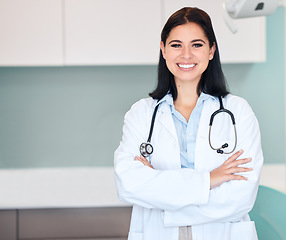 Image showing Happy woman, doctor and portrait of medical professional or dentist with arms crossed and stethoscope. Female person, surgeon or qualified healthcare expert smile in confidence at hospital clinic