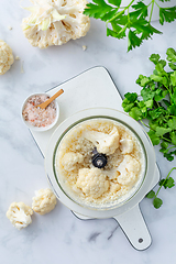 Image showing Preparing  cauliflower rice in a food processor, cauliflower in a blender.