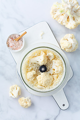 Image showing Preparing  cauliflower rice in a food processor, cauliflower in a blender.