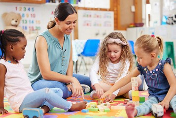 Image showing Toys, teacher and woman with education, students or ideas with conversation, lessons or teaching. Person, educator or children building, knowledge or kids in a classroom with kindergarten or learning