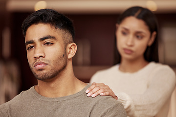 Image showing Divorce, fight and couple in a house with stress, worry or fear of infertility crisis in their home together. Marriage, conflict and sad man reject toxic woman in living room with argument or dispute