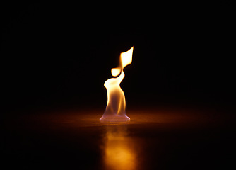 Image showing Flame, heat and fire with black background with start, gas and light from burning in studio. Fuel, flare and glow from thermal power and art in the dark with creativity and inferno with burn