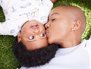 Image showing Mother, kiss and child on grass with black family, love and support together with baby in garden. Lawn, above and mom with happy kid, park smile and backyard with African mama and relax in nature