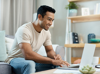 Image showing Laptop, typing and man on sofa for remote work, working from home and freelance career. Happy, living room and person on computer writing email for website, online project and internet research