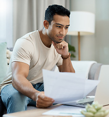 Image showing Home, bills and man on laptop thinking of finance, reading website and taxes or asset management on sofa. Young person with documents for mortgage, budget solution and insurance choice on computer