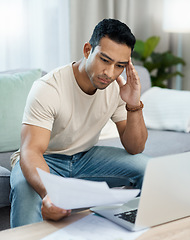 Image showing Man, bills and headache on computer and sofa for finance mistake, debt review or taxes stress at home. Young and confused person with documents for budget fail, bankruptcy or inflation news on laptop