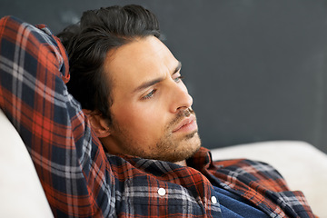 Image showing Thinking, depression or mistake with a man on a sofa in the living room of this home for problem solving. Stress, idea or regret and a young person in his apartment feeling shame, guilt or remorse