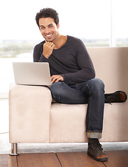 Image showing Man, portrait and work from home on laptop for graphic design career, planning and research on website and sofa. Startup freelancer or online designer relax on couch with computer and happy project