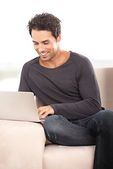 Image showing Happy man, work from home and laptop for marketing, copywriting and planning or research on website and sofa. Startup freelancer or blog writer relax on couch with computer, internet or happy project