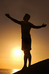 Image showing Silhouette, man and stretching with hands for yoga, health and wellness on beach with sunset and zen. Person, shadow and pilates or sunrise for balance, mindfulness and healthy body by ocean or sea