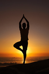 Image showing Silhouette, man and namaste with hands for yoga, health and wellness on beach with sunset and zen. Person, shadow and pilates or praying for balance, mindfulness and healthy body by ocean or sea