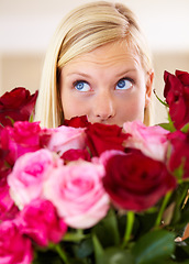 Image showing Woman, rose bouquet and eyes with closeup, beauty and arrangement with studio background, surprise and gift. Look, female model and flowers for love, present and valentines day with romantic gesture