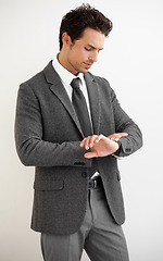 Image showing Businessman, watch and thinking for time in studio, late or meeting with mock up on white background. Professional person, manager and checking for clock in space for formal, modern or trendy fashion