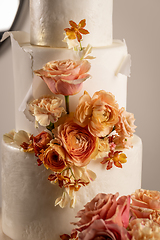 Image showing Wedding cake with peach fuzz colored flower