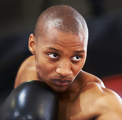 Image showing Boxing, gloves and face of black man training with fitness, power and workout challenge in club. Strong body, muscle and boxer in gym, athlete with fist up and confidence in competition fighting.