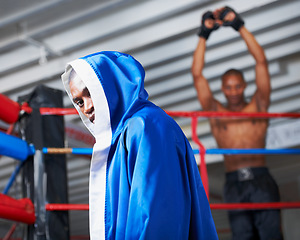 Image showing Black man, portrait and boxing champion in robe for ring match, competition or fight at gym. Face of serious African male person or professional boxer ready for fighting challenge, MMA or sports