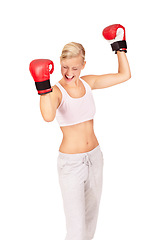Image showing Woman, boxer and success for fight winner, achievement and victory match by white background in studio. Person, athlete and boxing champion in celebration for fitness, workout and exercise training