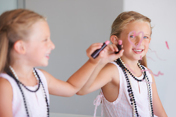 Image showing Little girl, makeup and writing on mirror in bathroom for mess, naughty and bad behavior. Youth, kid and happy for drawing with lipstick, pink and cosmetics for beauty with smile for portrait in home