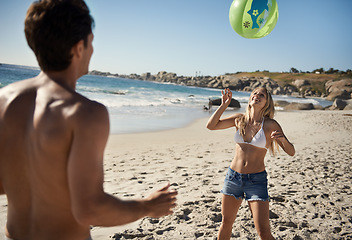 Image showing Couple, ball playing and fun by beach in summer with love, care and support together on a holiday. Happy, vacation and date by the sea in Miami with freedom and travel by the ocean on a trip outdoor