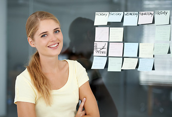 Image showing Woman, planning and sticky notes on glass, graph and smile for seminar, creative and portrait. Presentation, strategy and office job for weekly schedule, workplace and financial audit report