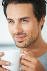 Image showing Relax, face and happy man with coffee break in a house with me time, peace or weekend freedom at home. Smile, chilling and male person with tea in a. living room for a calm moment of reflection