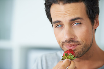 Image showing Portrait, man and eating strawberry, healthy food or organic vegan product for weight loss benefits, wellness or breakfast. Vitamin C, headshot and face of male nutritionist with fruit nutrition meal