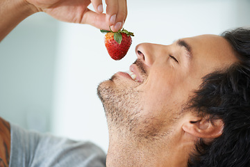 Image showing Healthy food, relax man and eating strawberry for morning diet, organic vegan lifestyle or weight loss benefits, wellness or breakfast. Vitamin C, eyes closed and face of person enjoy fruit nutrition