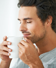 Image showing Man, coffee and smell for morning happy or breakfast beverage, calm chill on lazy weekend. Male person, mug and caffeine latte cup for peace cappuccino aroma in home, quiet espresso time for comfort