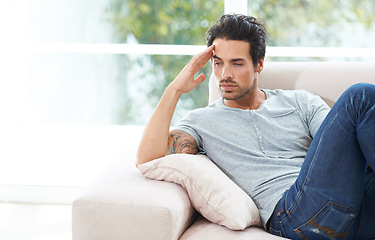 Image showing Man, thinking and sofa for unhappy in home or lonely grief mourning, broken heart or stress. Male person, sad thoughts on couch for depressed risk or loss problem from anxiety, mental health or fail