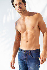 Image showing Portrait, fashion and body with a young man outdoor on a white background for masculine style. Summer, shirtless and the muscles of a confident young model in a denim jeans for health or fitness