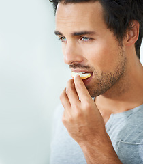 Image showing Man, face or eating apple fruit for morning diet, healthy lifestyle choice or clean nutritionist breakfast, organic snack or vitamin. Natural detox, nutrition food or person bite antioxidants product