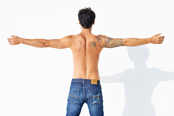 Image showing Back, muscle and shirtless with man, fitness and promotion isolated on a white studio background. Person, guy and model with exercise, jeans and strong with health, mockup space and body with care