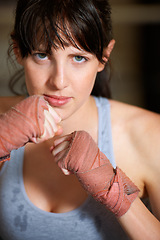 Image showing Boxing, hands and portrait of woman with confidence, power and fearless training challenge in gym. Strong body, muscle and face of boxer, athlete or girl with fist up for fitness in competition fight