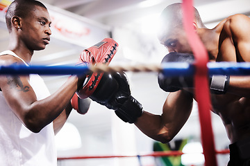 Image showing Man, boxing and personal trainer in ring fight at gym for workout, exercise or indoor self defense training together. Male person, boxer or fighting sparing partner in sports, competition or practice