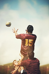 Image showing Rugby ball, sports and teamwork with man on field for training, health and stadium practice. Challenge, competition and performance with person in outdoor pitch for exercise, games and workout