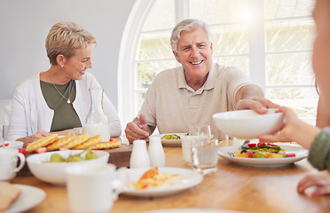 Image showing Breakfast, family and hungry with senior couple, cooking.and happy together in a home. Love, support and care on a dining room with a smile and food with bonding in the morning with fruit in a house