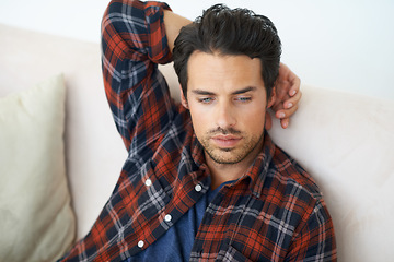 Image showing Relax, thinking and man on sofa in living room for afternoon nap, resting and calm in home. Reflection, sleep and person on couch lying for wellness, comfortable and peace in apartment for ideas