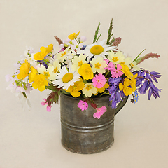 Image showing Spring Wildflower Aarrangement in an Old Metal Tin Vase