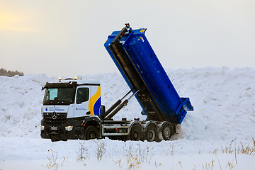 Image showing Mercedes-Benz Tipper Truck Unloads Snow