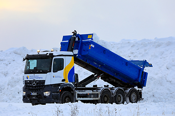 Image showing Mercedes-Benz Tipper Truck Unloading Snow