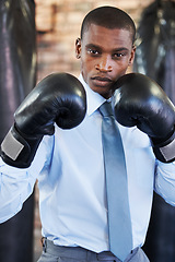 Image showing Man, portrait and boxing gloves in suit confident for manager job, ready for business or corporate competition. Black person, face and fighter gear for office achievement, career promotion at work